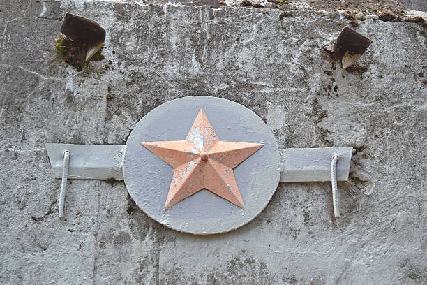 istock Red Star on a concrete wall of an old bunker. 470606676