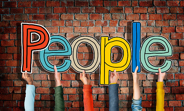 istock Multiethnic Group of Hands Holding Word People 470606808