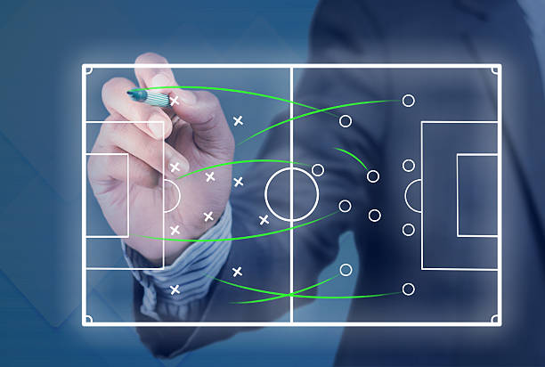istock Game plan for a soccer game being edited by a man in a suit 470607584