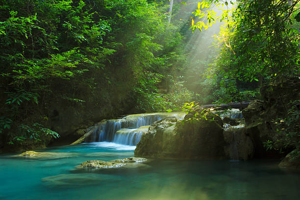 Erawan waterfall Relaxing view of Erawan waterfall, Erawan National Park, Thailand tranquil scene stock pictures, royalty-free photos & images