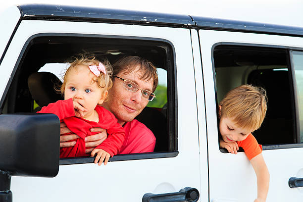 istock family driving off-road car on tropical beach 470608672