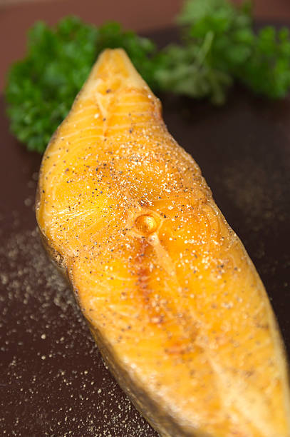 istock Smoked Halibut with black pepper and parsley on braun 470608679