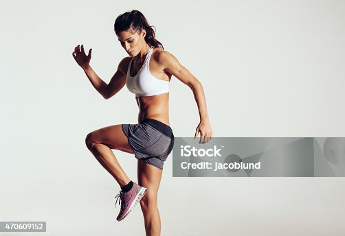 istock Attractive fit woman exercising in studio with copyspace 470609152