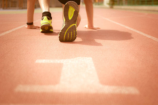 istock man ready to run on the running track 470611296
