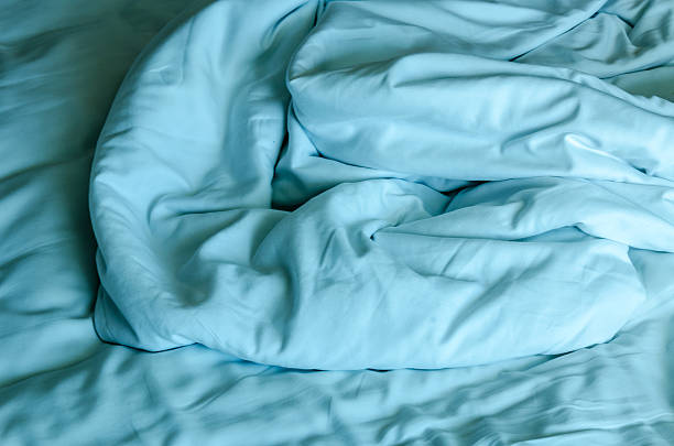 istock Bed sheet pillows and blanket messed up in the morning 470611454