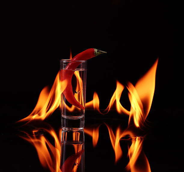istock Hot chili pepper in a  cognac ballon with 470611598
