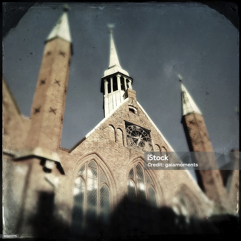 Holy Spirit Hospital Facade and spires of the historic Heiligen-Geist-Hospital in Lübeck, Schleswig-Holstein, Germany. This building dates back to the year 1227. Antique Stock Photo