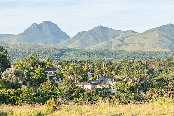 View of George in South Africa View of one of the suburbs in George with the Outeniqua Mountains in the background george south africa stock pictures, royalty-free photos & images