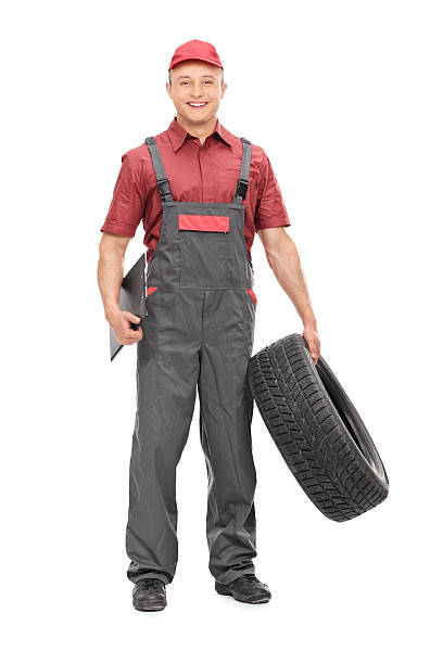 istock Mechanic holding a tire and clipboard 470615794