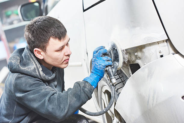 istock auto mechanic polishing car 470615798