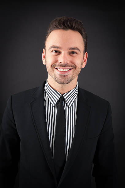 istock handsome man doing different expressions in different sets of clothes 470616716