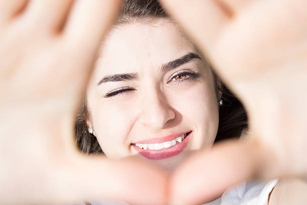 istock Smiling beautiful girl winking 470618048