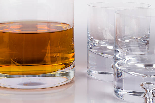 istock Scotch crystal bottle, with glasses and a drink 470618434