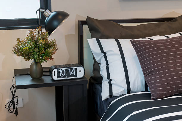istock modern bedroom with brown, black and white striped pillows 470621106