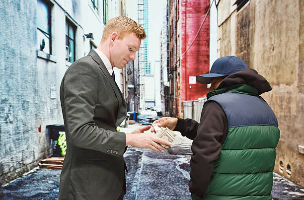 istock Customer buys from drug dealer 470621608