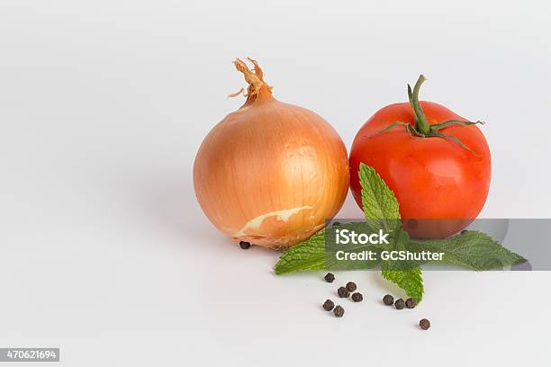 Onion And Tomatoes With Fresh Mint Leaves And Peppercorns Stock Photo - Download Image Now