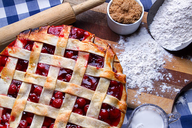 istock Fresh Hot Homeade Cherry Lattice Pie with Ingredients 470622224