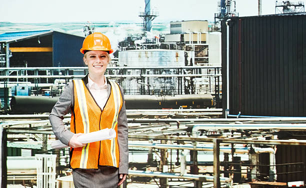 istock Smiling female architect in oil refinery 470622298