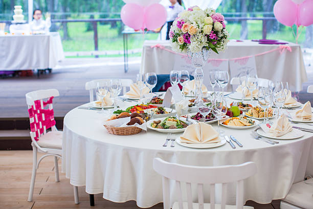 istock Wedding white banquet tables prepared for celebration 470622757