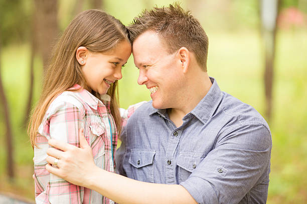 istock Father, daughter hugging outdoors. Parent, child. Love, affection. 470622828