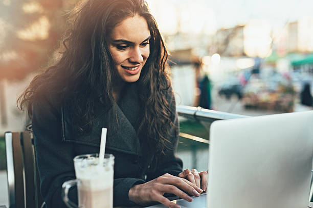istock Young lady browsing the Internet at the cafe 470622952