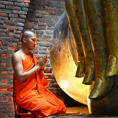 Buddhist monk praying At The National Historical Park, Sukhothai