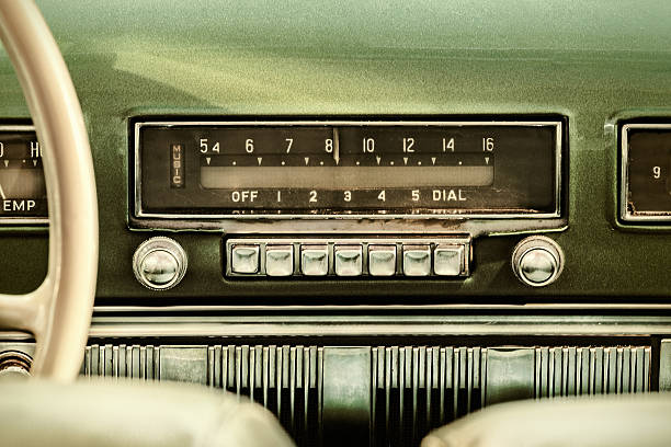 Retro styled image of an old car radio Retro styled image of an old car radio inside a green classic car 1950 stock pictures, royalty-free photos & images