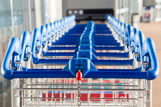 istock Row of paid luggage carts with a coin space 470623780