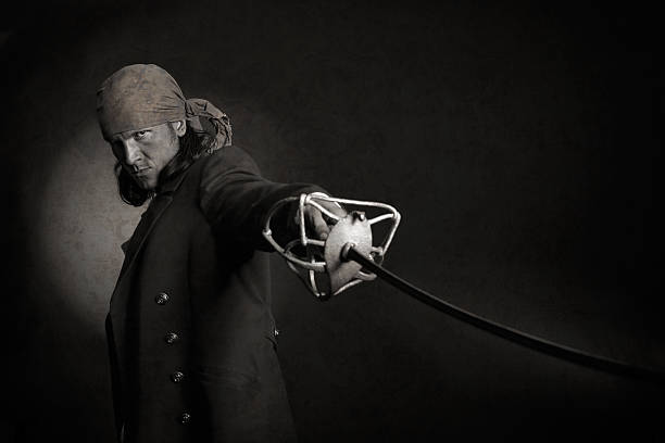 istock vintage style sepia toned pirate with cloak and sword 470623950