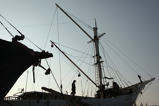 Jakarta, Indonesia - August 16, 2011: Wooden sailing ships called pinisi in the historical port of Sunda Kelapa in Jakarta, Central Java, Indonesia.