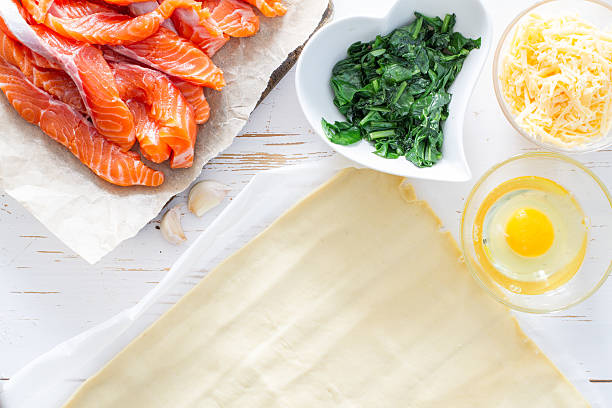 istock Preparation of strudel pie with salmon and spinach 470624172