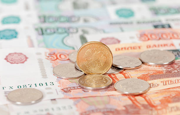istock Russian currency, rouble: banknotes and coins close up 470624438