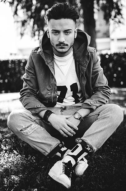 istock fashionable young adult posing serious 470624630