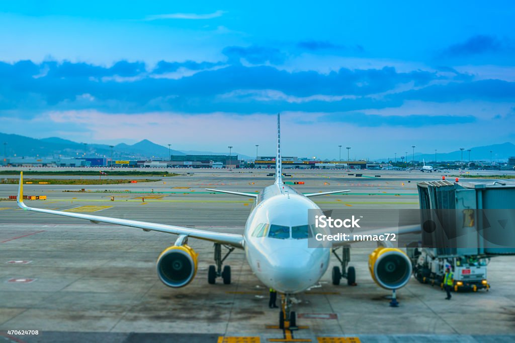 Airplane at the airport Airplane standing at the gate, ready to be prepared for next take off. 2015 Stock Photo