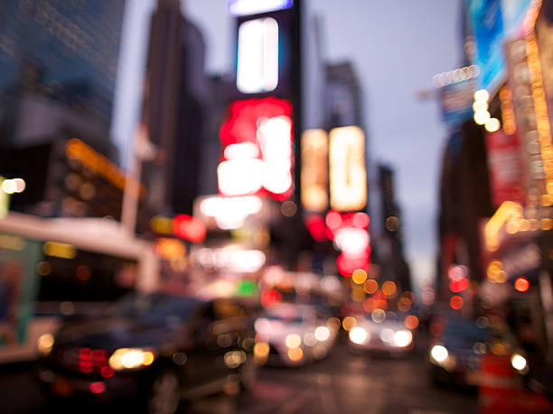 Defocused night traffic scene on Broadway in Times Square, New York City. Slight grain effect in shadow areas.