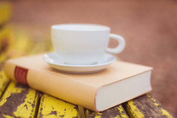 istock Closed book and cup outdoor 470626769