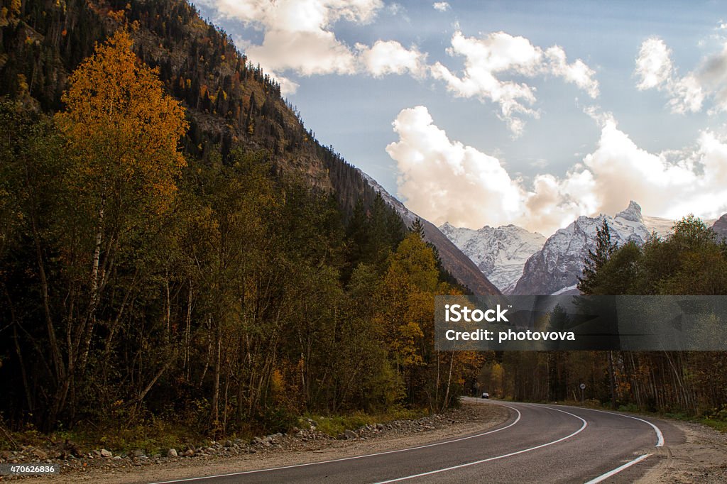 Mountain peaks in clouds Landscape of mountains Caucasus region in Russia Mountain peaks in clouds. Caucasus. Dombay. 2015 Stock Photo