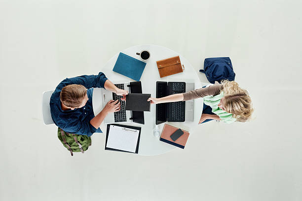 istock Above view of two students studying together 470627784