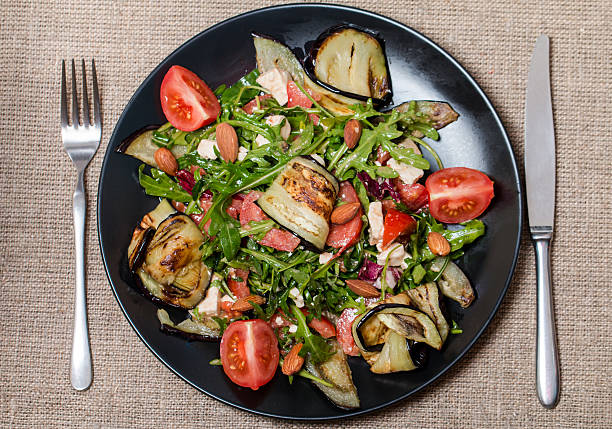 istock Eggplant salad with tomatoes and arugula 470628628