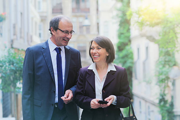 istock Business man and woman talking and going to work 470628636
