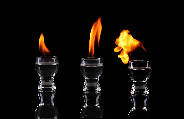 istock collage Glass of tequila and flames 470628732