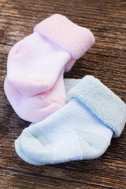 istock baby pink and blue socks 470629304