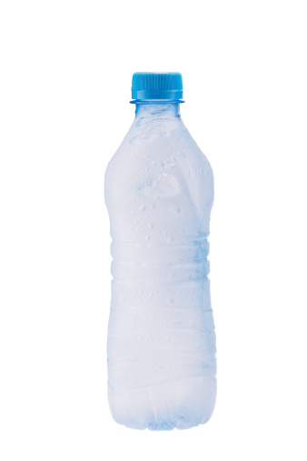 Misted plastic bottle with frozen water inside and water drops on the surface