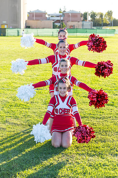 istock Group of Cheerleaders in the Field 470631515