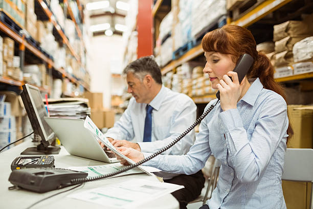 istock Manager working with laptop and talking on phone 470633056