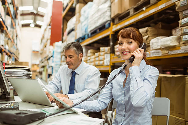 istock Manager working with laptop and talking on phone 470633078