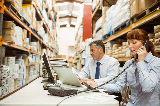 istock Manager working with laptop and talking on phone 470633102