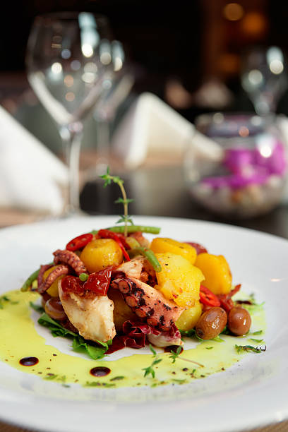 istock Appetizer with grilled octopus, potatoes and vegetables 470634198