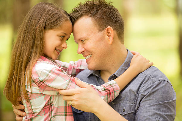 istock Father, daughter hugging outdoors. Parent, child. Love, affection. 470635678