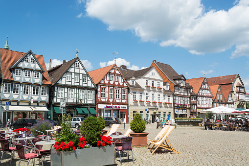 Celle, Germany - July 18, 2013: The street with historical half-timbered houses in the old city of Celle, Germany. Celle has a picturesque old town centre (the Altstadt) with over 400 timber-framed houses, making Celle one of the most remarkable members of the German Timber-Frame Road.